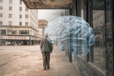 This shows an older person walking in a street and a brain.