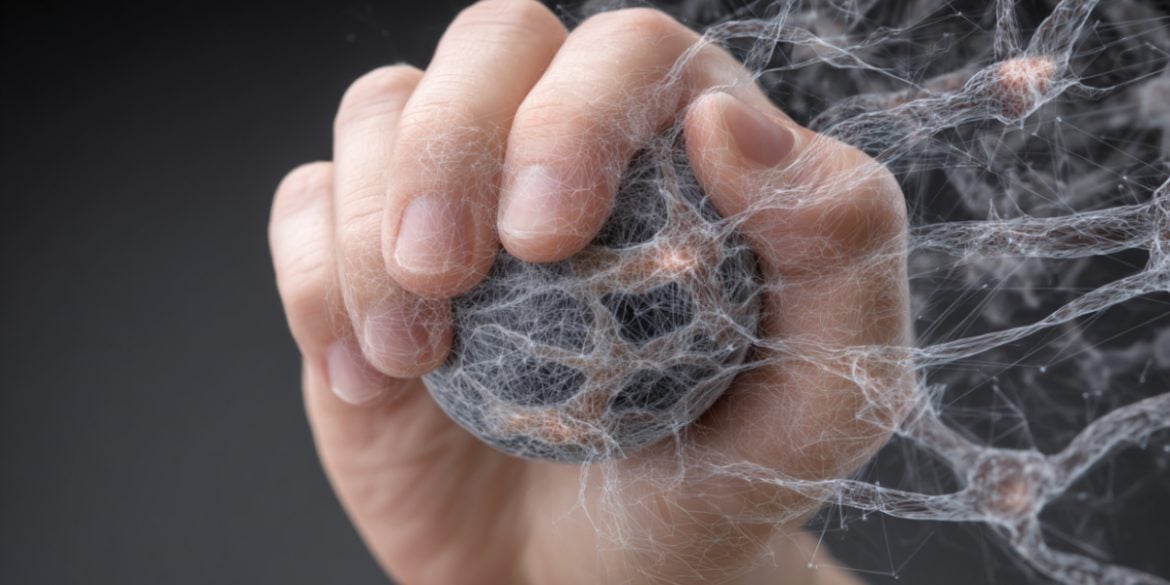 This shows a hand gripping a ball.