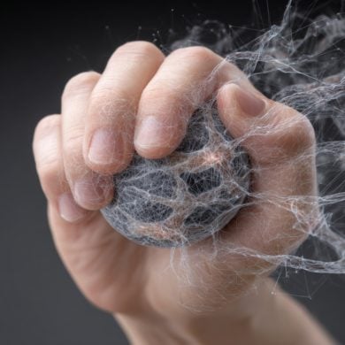 This shows a hand gripping a ball.