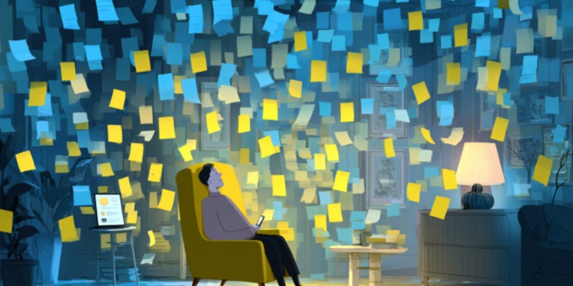 This shows a man sitting in a room full of post-it notes.