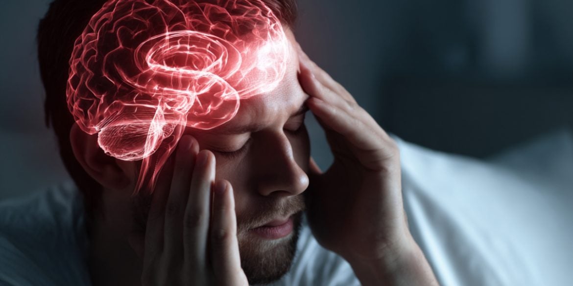 This shows a man holding his head in pain.