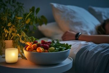 This shows a person sleeping and a bowl of fruit.