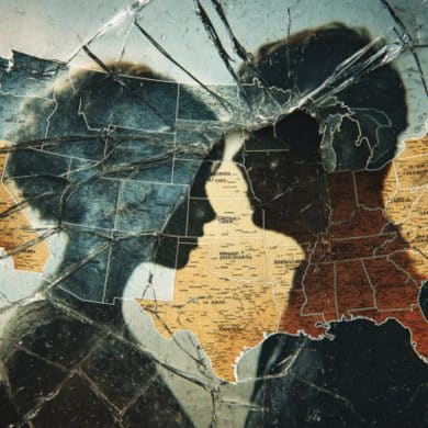 This shows a map of the US and a couple behind shattered glass.