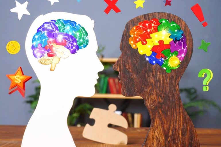 This shows the outline of two heads and brains. One brain is foggy, as though representing depression.