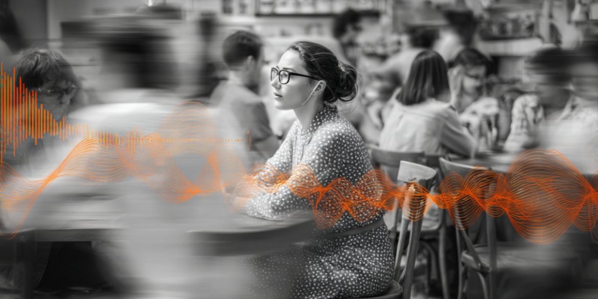 This shows a person in a crowded cafe.