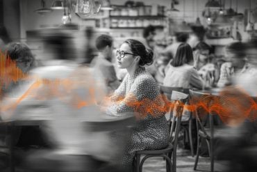 This shows a person in a crowded cafe.