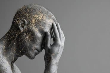 This shows a statue of a person holding their head. Neurons are overlayed.