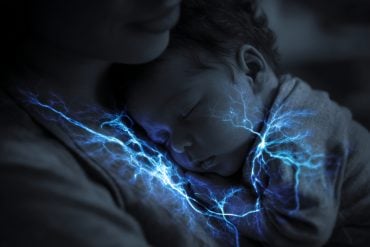This shows a baby snuggling to its mom.