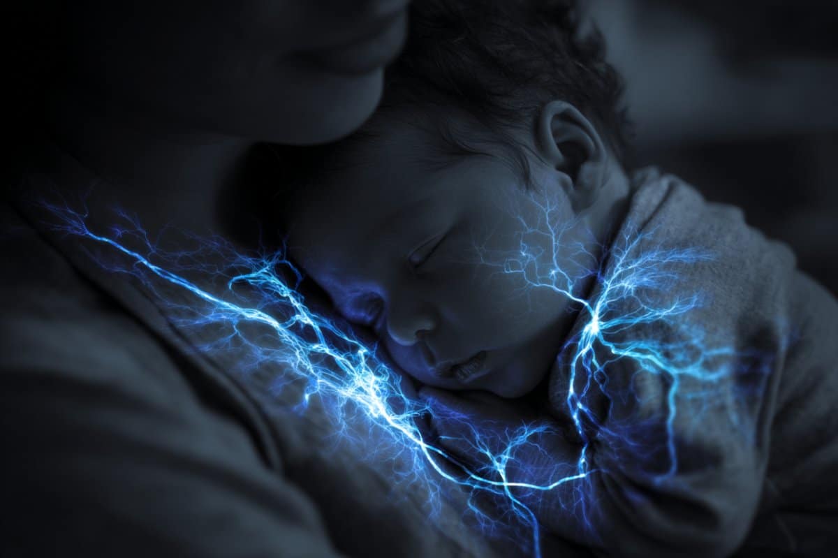 This shows a baby snuggling to its mom.