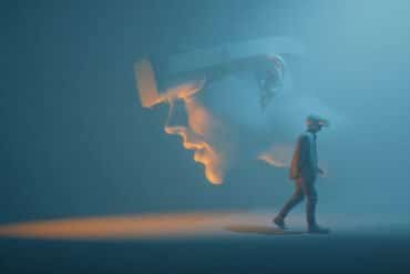 This shows a person walking away from an oversized face.