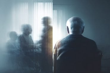 This shows an older man sitting alone.