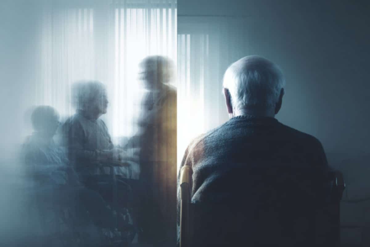 This shows an older man sitting alone.