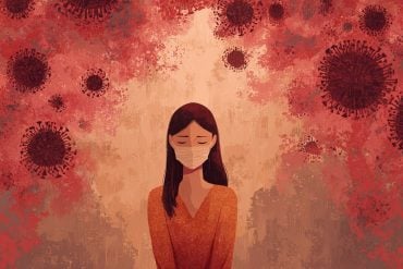 This shows a woman in a face mask surrounded by the COVID virus.