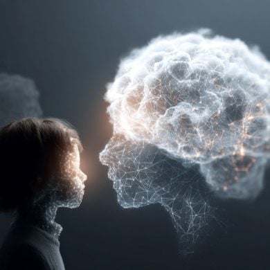 This shows a person looking at a cloud covered, digital head, symbolizing a human connection with AI chatbots.