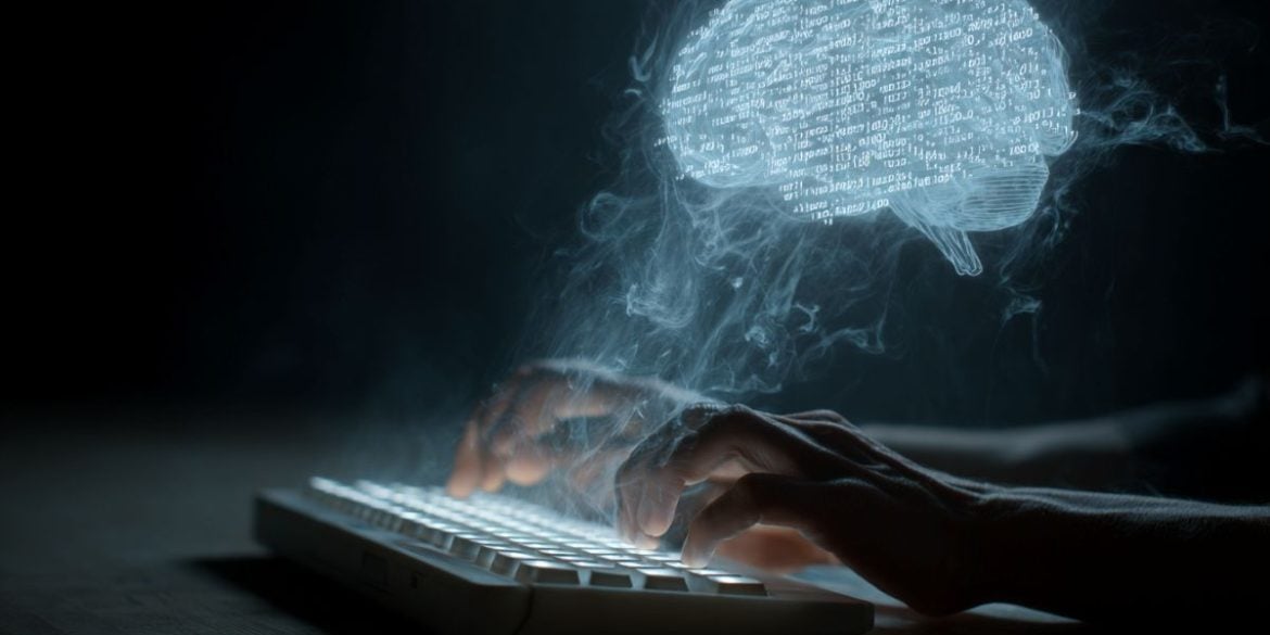 This shows a person typing and a brain with code in it.