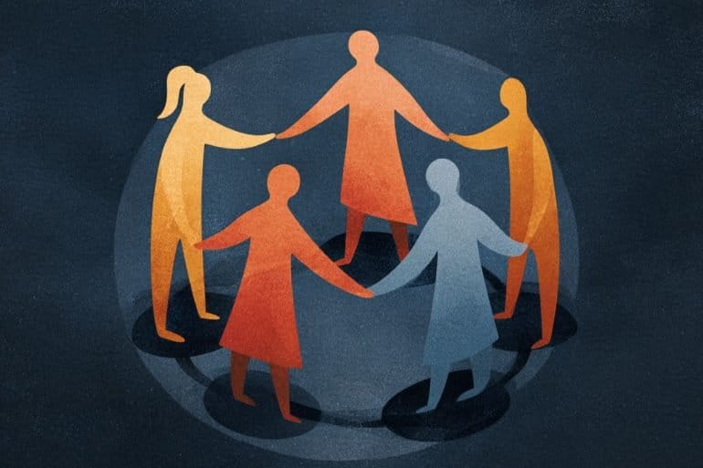 This shows people in a circle all holding hands.