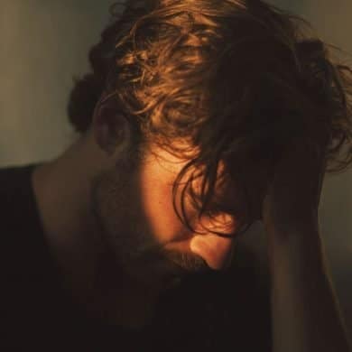 This shows a man holding his head.