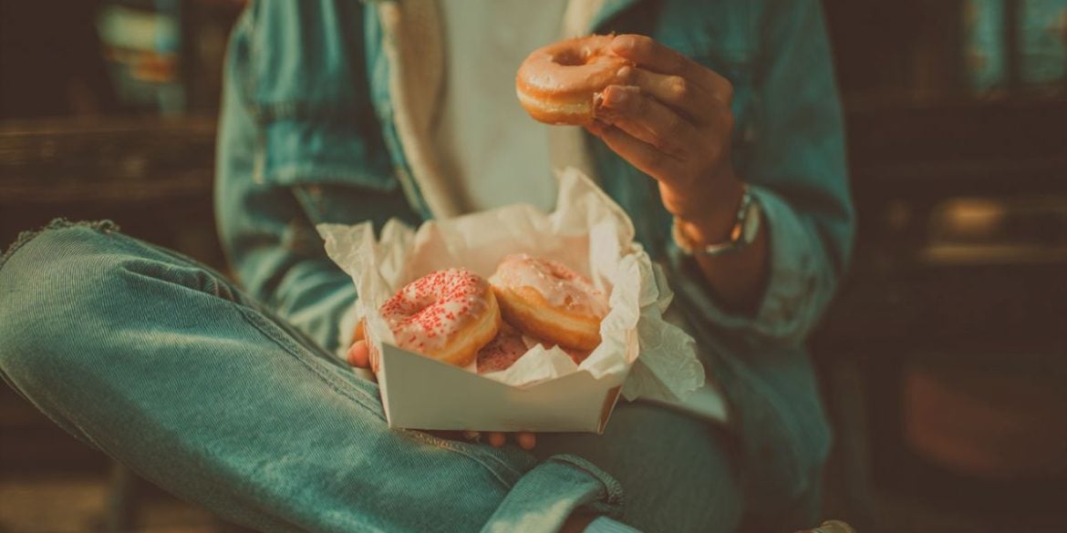 This shows a person eating donuts.