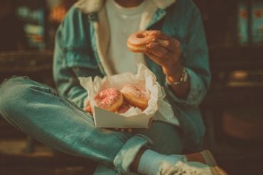 This shows a person eating donuts.