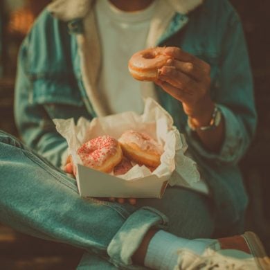 This shows a person eating donuts.