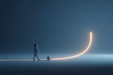 This shows a toddler kicking a soccer ball.