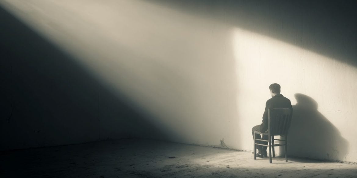 This shows a person sitting alone.