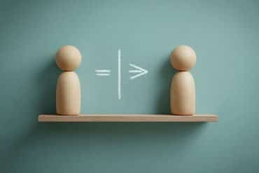 This shows two wooden figures and math symbols.