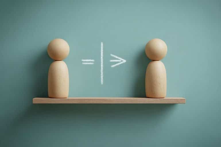 This shows two wooden figures and math symbols.