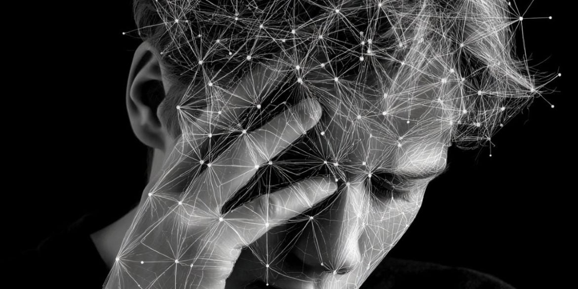 This shows a person holding their head overlayed with a network of lines.