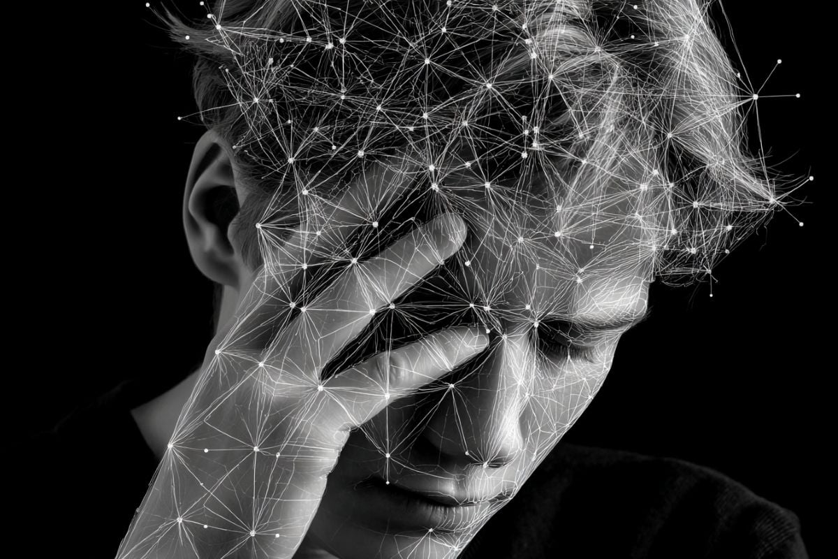 This shows a person holding their head overlayed with a network of lines.