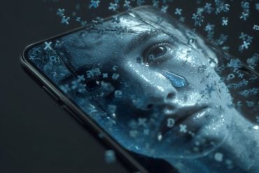 This shows a person crying on a cell phone screen.
