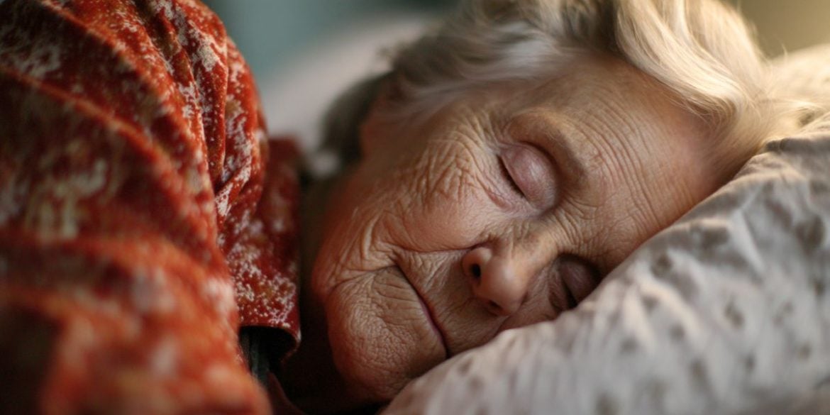 This shows a sleeping older woman.