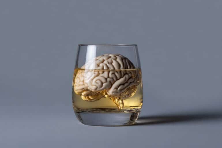 This shows a brain in a scotch glass.