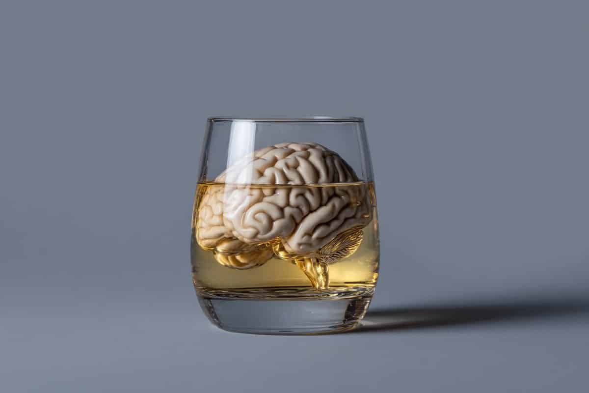 This shows a brain in a scotch glass.