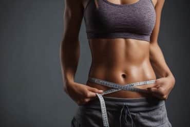 This shows a woman measuring her waist.