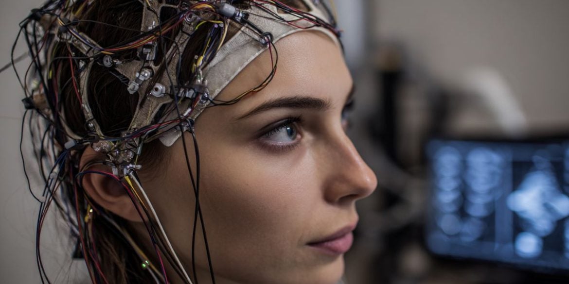 This shows a woman in an EEG cap.