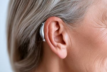 This shows an ear and a hearing aid.