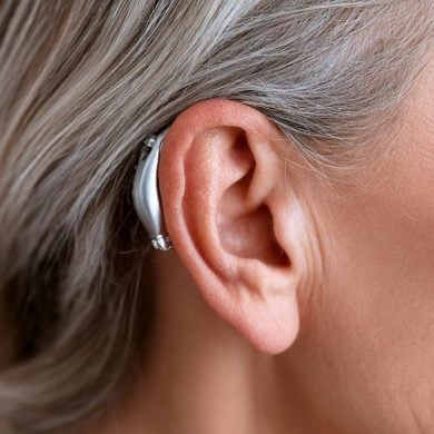 This shows an ear and a hearing aid.