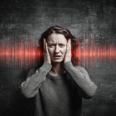 This shows a woman holding her ears, surrounded by sound waves.