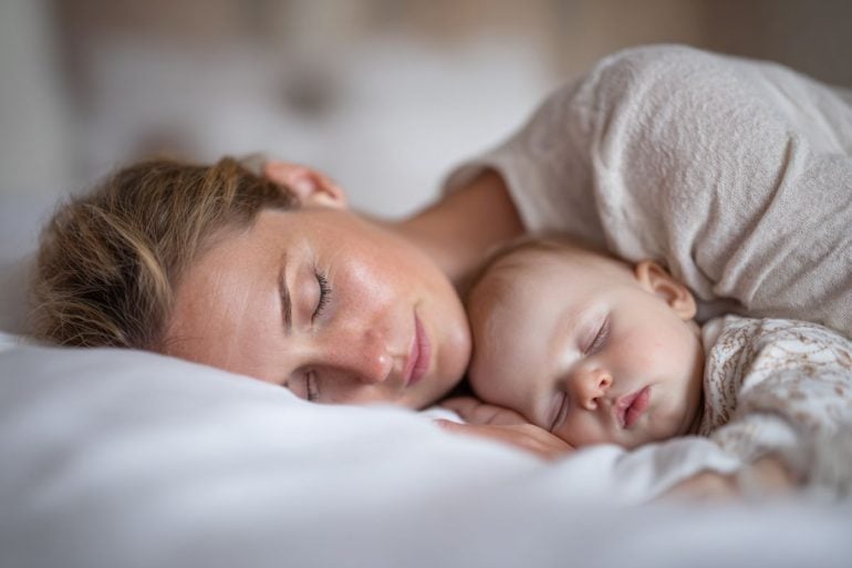 This shows a woman and baby sleeping.