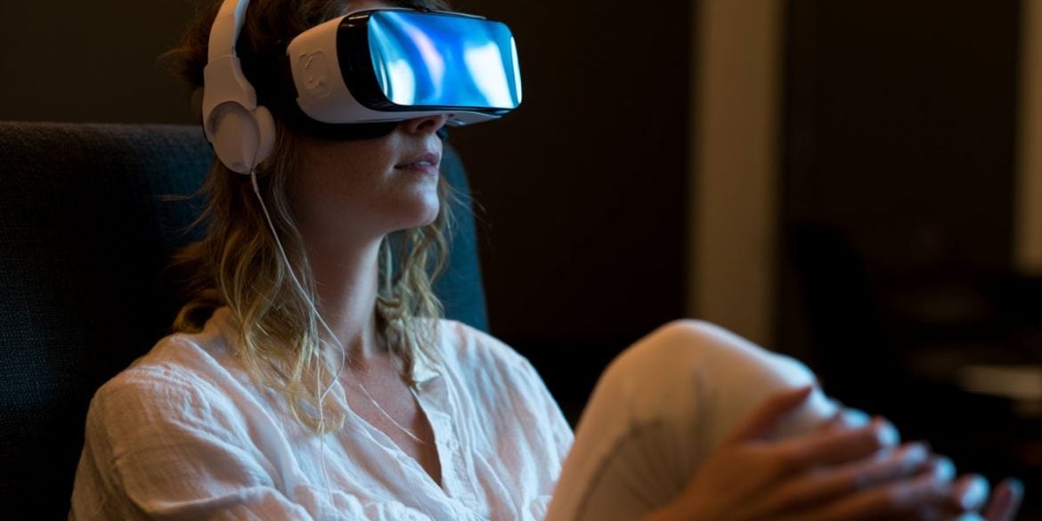 This shows a woman in a VR headset.