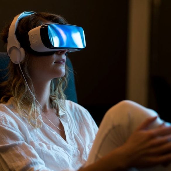This shows a woman in a VR headset.