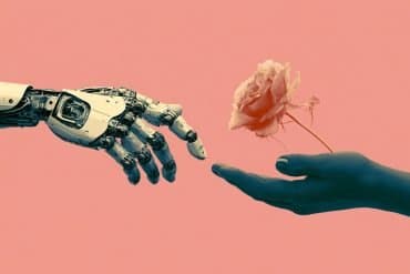 This shows a robot hand and a human hand holding a rose.