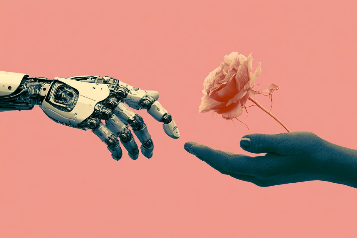 This shows a robot hand and a human hand holding a rose.
