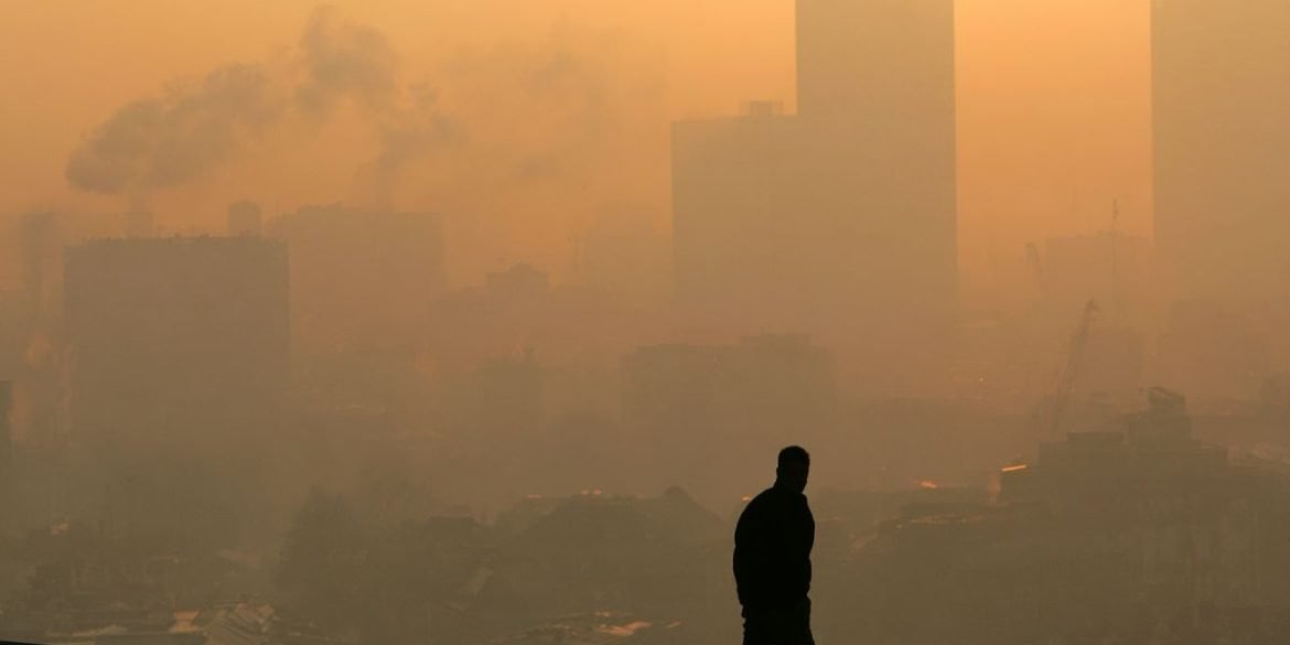 This shows a person in a smog filled city.