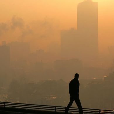 This shows a person in a smog filled city.
