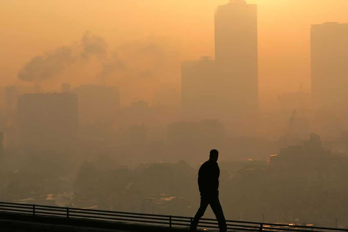 This shows a person in a smog filled city.