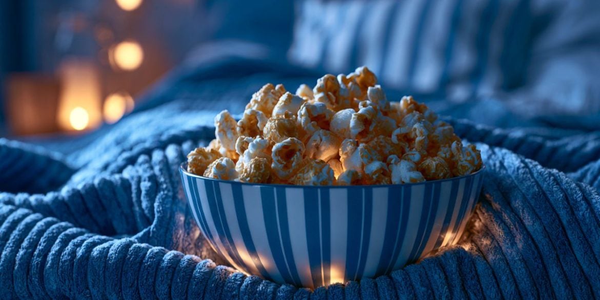 This shows popcorn on a bed.