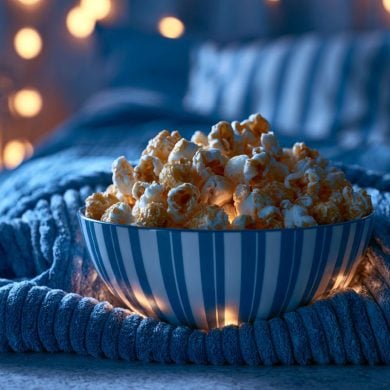 This shows popcorn on a bed.