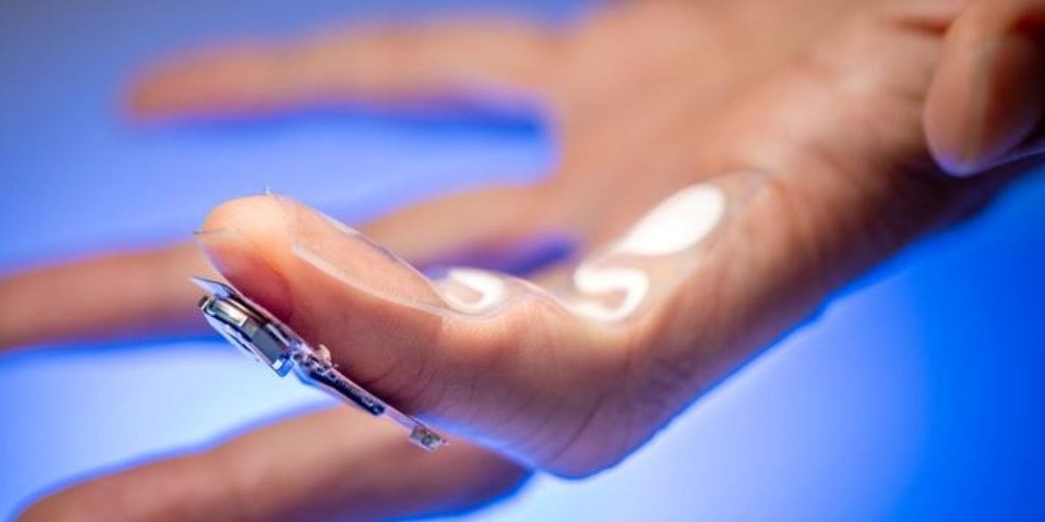 This shows the device on a person's finger.